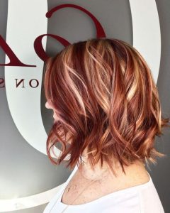 pops of blonde in red hair