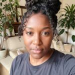 High Bun With Curled Bangs Marley Twists
